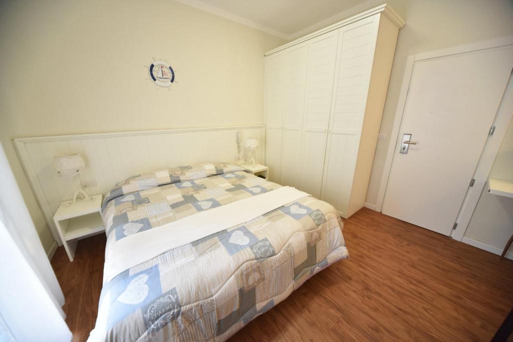 Postel nebo postele na pokoji v ubytování Hotel Villa Edda
