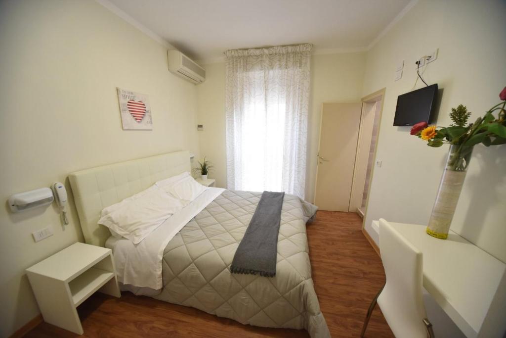 Postel nebo postele na pokoji v ubytování Hotel Villa Edda