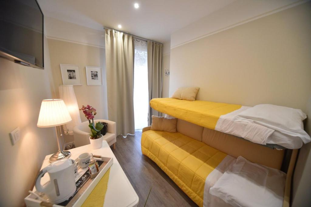 Postel nebo postele na pokoji v ubytování Hotel Villa Edda
