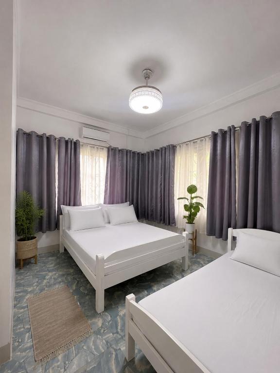 מיטה או מיטות בחדר ב-Cazabela 5pax 2BR with Breakfast