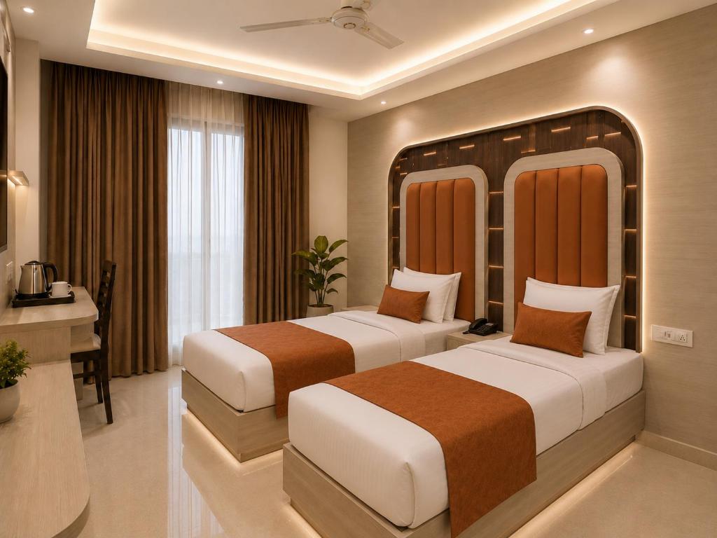 two beds in a hotel room with a desk and a room at Hotel Cloud Suites Delhi Airport in New Delhi