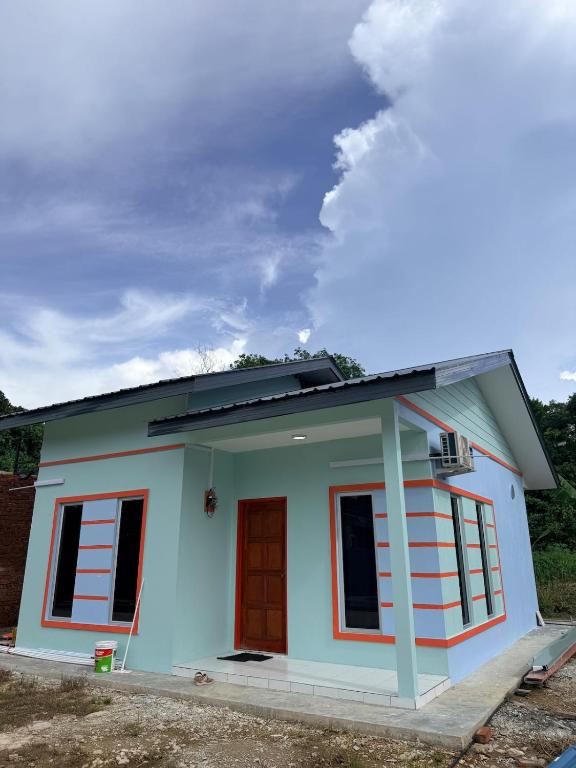 a small house is good enough for a family of four at AiNi's Homestay in Sipitang