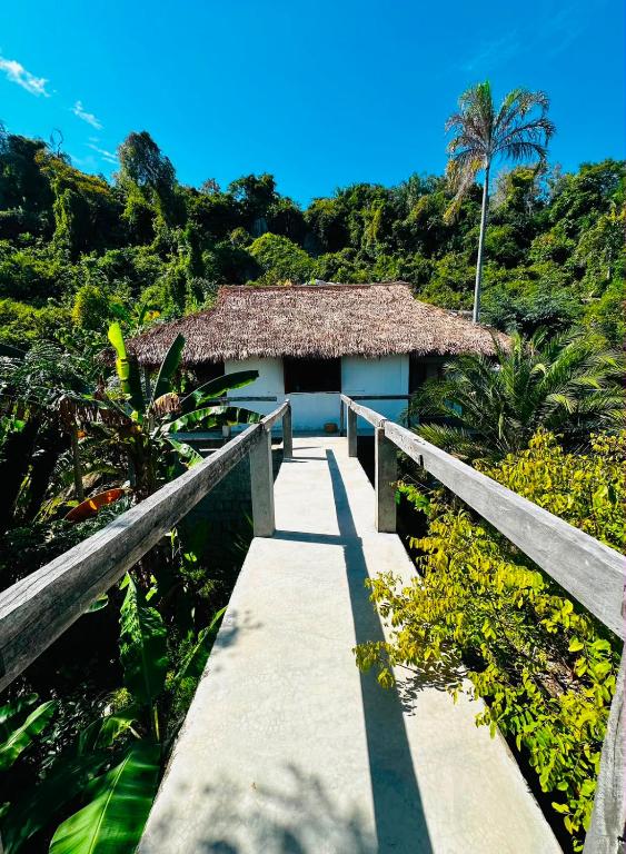a walkway leading to a building on a hill at Canopee Lodge in Nosy Komba
