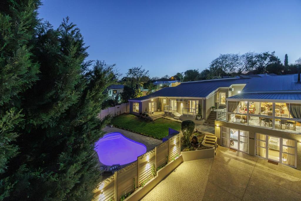 an aerial view of a house with a swimming pool at 17 On Cedar Boutique Guesthouse in Durbanville