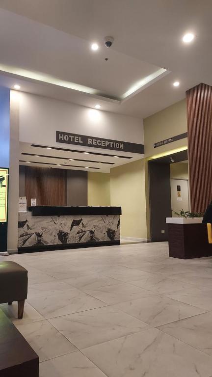 a hotel lobby with a hotel rejection sign on the wall at Paradise Grand Hotel Delhi igi Airport in Etāwah