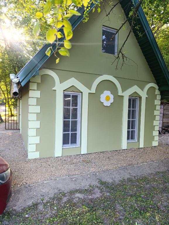 a dog house with a window on the side of it at Sumski raj Gornje podunavlje in Sombor