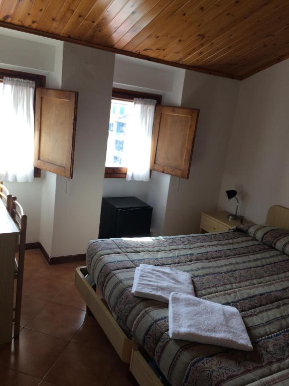 Postel nebo postele na pokoji v ubytování Hotel Bodoni