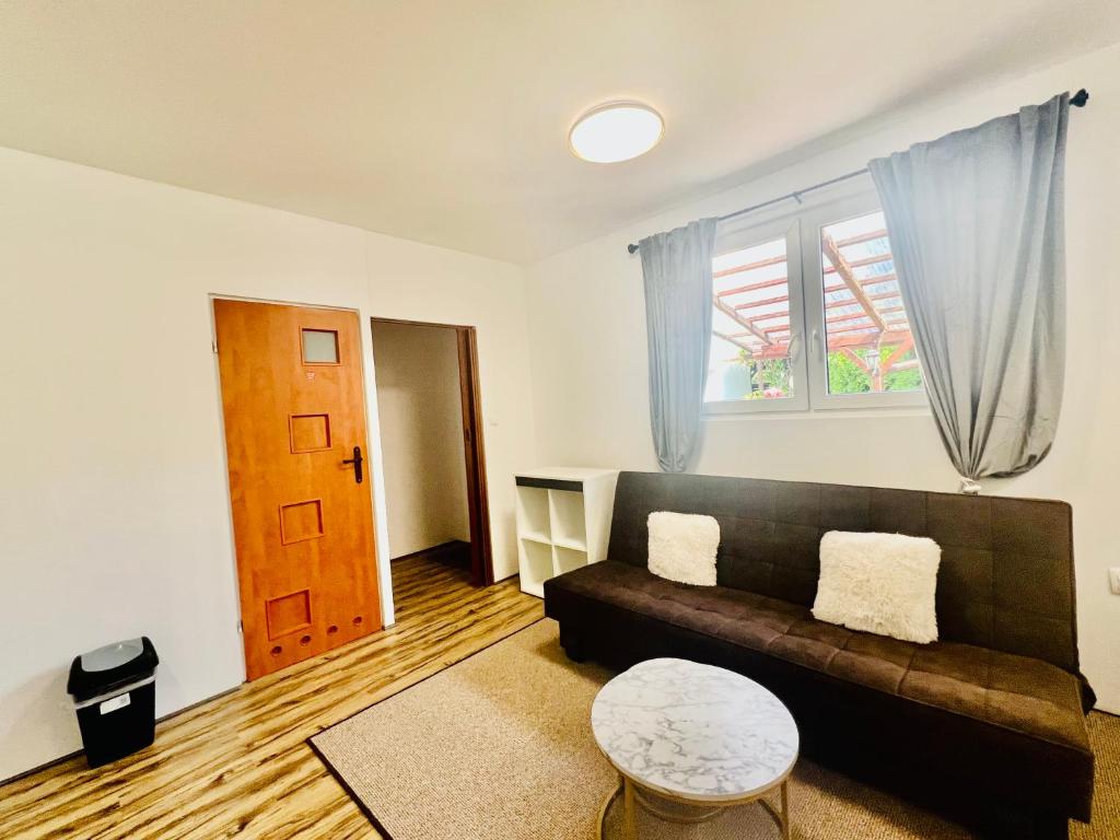 a living room with a couch and a table at Studio Tatarskie,Parking! in Przemyśl