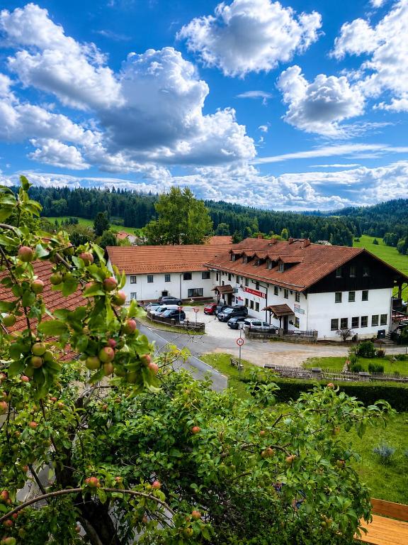 a view of a building with a parking lot at Burggasthof Weißenstein in Regen