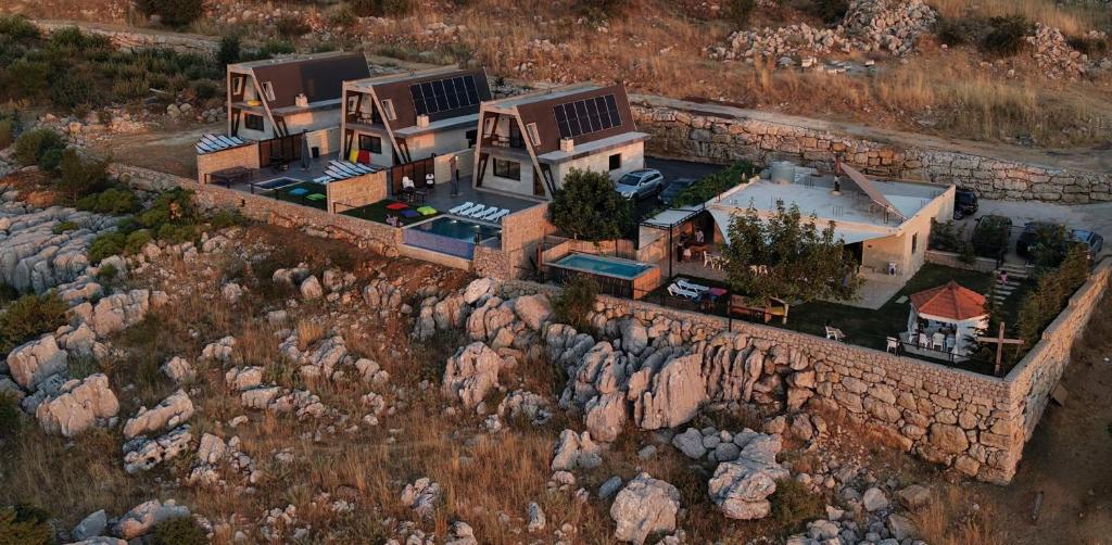 an aerial view of a house on a mountain at The Skyloft Tarchich - Panoramic Mountain Escapes in Aswāq aş Şafşāf