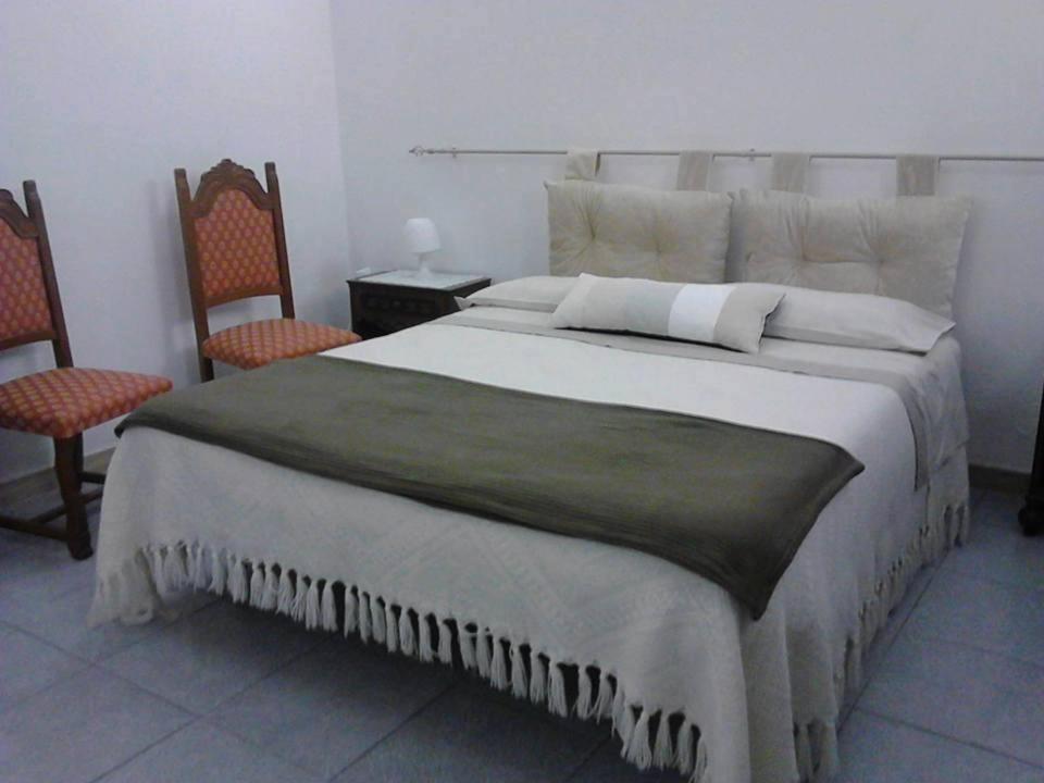 Postel nebo postele na pokoji v ubytování B&B Il Tulipano