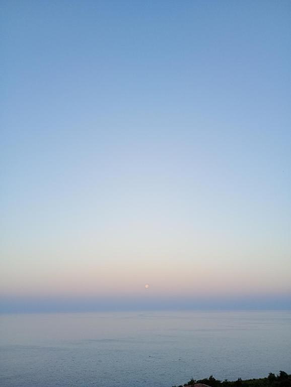 a foggy view of the ocean in the distance at Amore apartments in Budva
