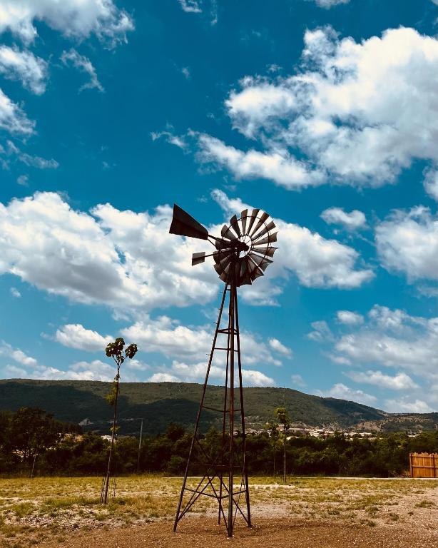 a windmill sitting in the middle of a field at Le Stéréo Motel in LʼHospitalet
