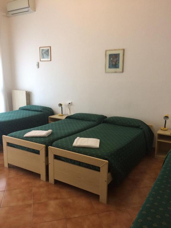 Postel nebo postele na pokoji v ubytování Hotel Bodoni