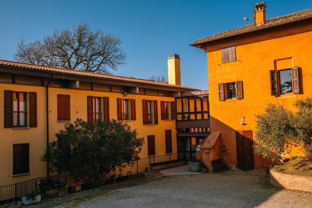 a group of buildings in a courtyard at Debre Mariam Guest House in Bologna