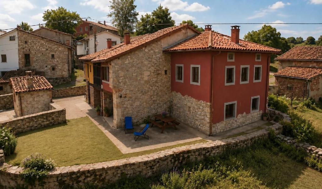 an aerial view of a house with a yard at Casa Rural La Eugenia · Picos de Europa · Cabrales in Puertas