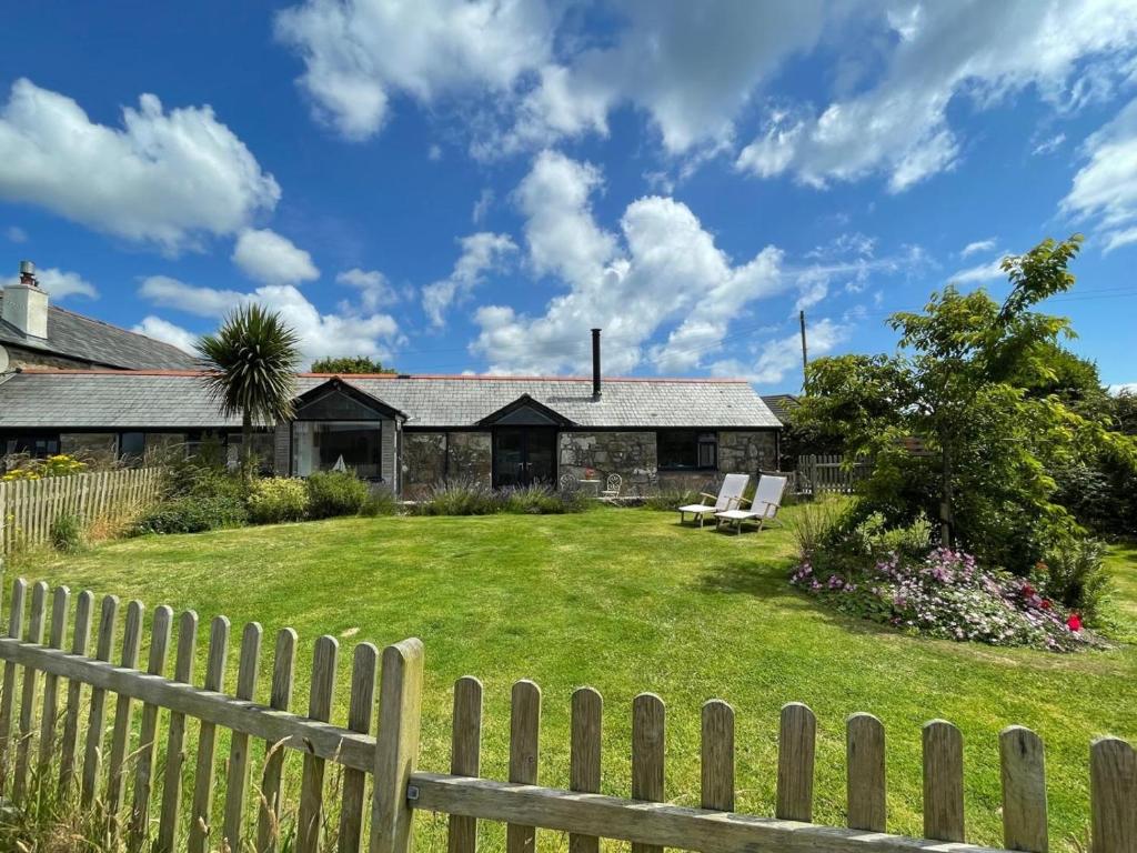 a house with a fence and a yard at 1 Bed in Penzance oc-78517 in Newlyn