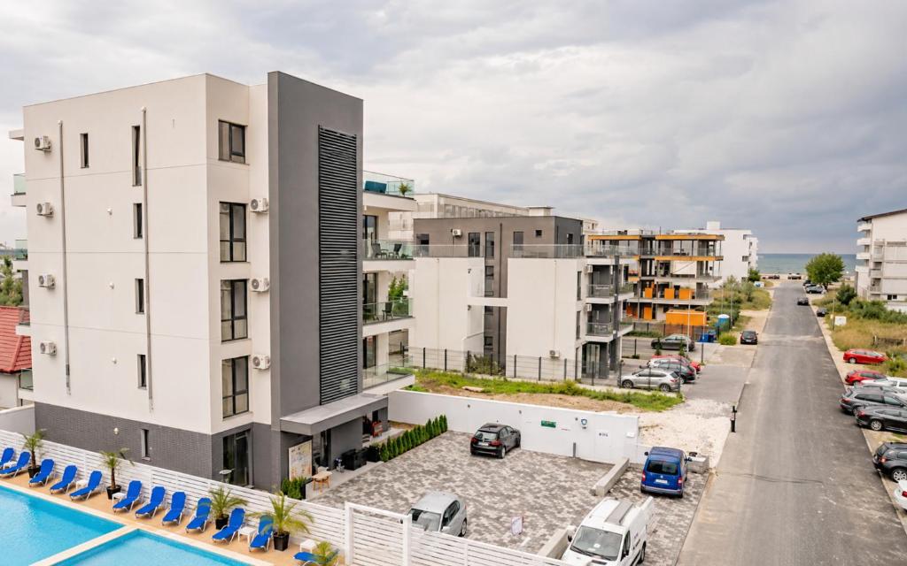 arial view of a hotel with a pool and buildings at RIA Apartments in Mamaia Sat/Năvodari