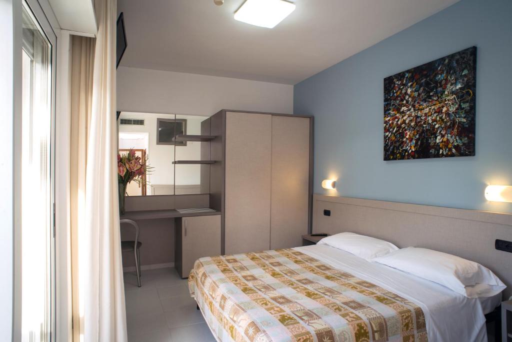 Postel nebo postele na pokoji v ubytování Hotel Clipper