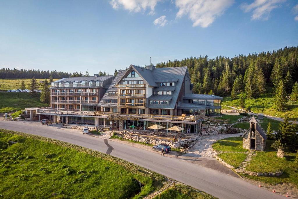 an aerial view of a large building on a hill at Erlebachova Bouda, hotel - Resort Svatý František in Špindlerův Mlýn
