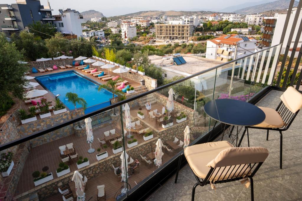 a balcony with a view of a swimming pool at Moncler Residence in Ksamil