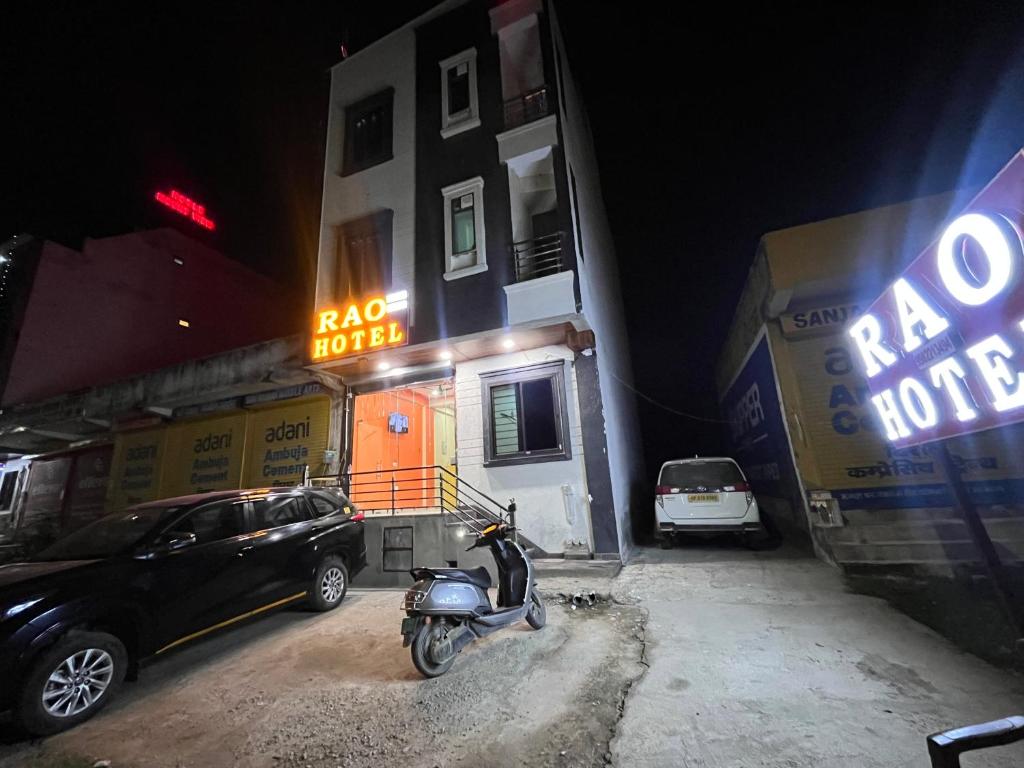 a scooter parked in front of a building at night at Rao hotel in Jaipur