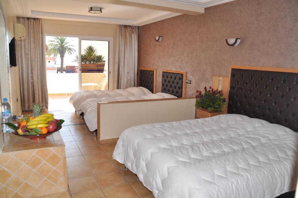 Postel nebo postele na pokoji v ubytování Hotel Club Almoggar Garden Beach