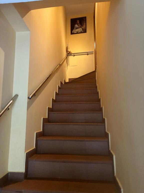 a staircase in a building with a picture on the wall at Plazacuervo in Pancorbo