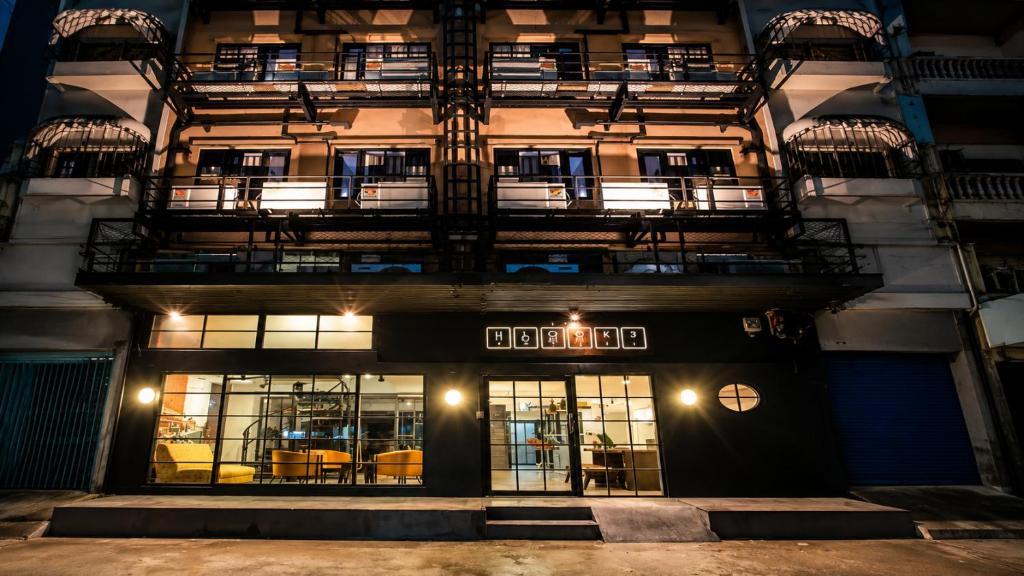 a building with a fire escape on the side of it at The Blocks Hostel Sukhumvit 10 in Bangkok