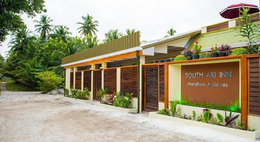 a building with a sign that reads south ak inn at South Ari Inn in Mandhoo