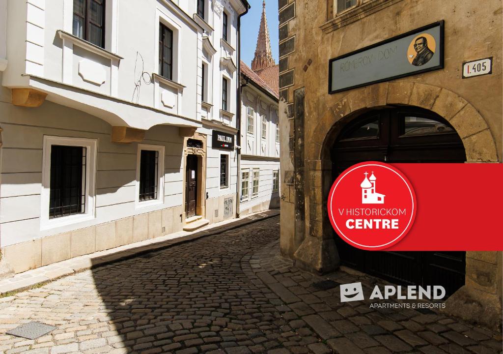 a street with a sign on the side of a building at APLEND CITY Paul Inn in Bratislava
