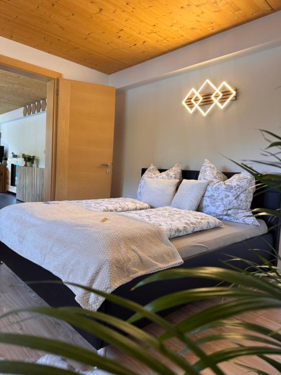 a bedroom with a large bed with pillows at Apartment Sophia in Rangersdorf