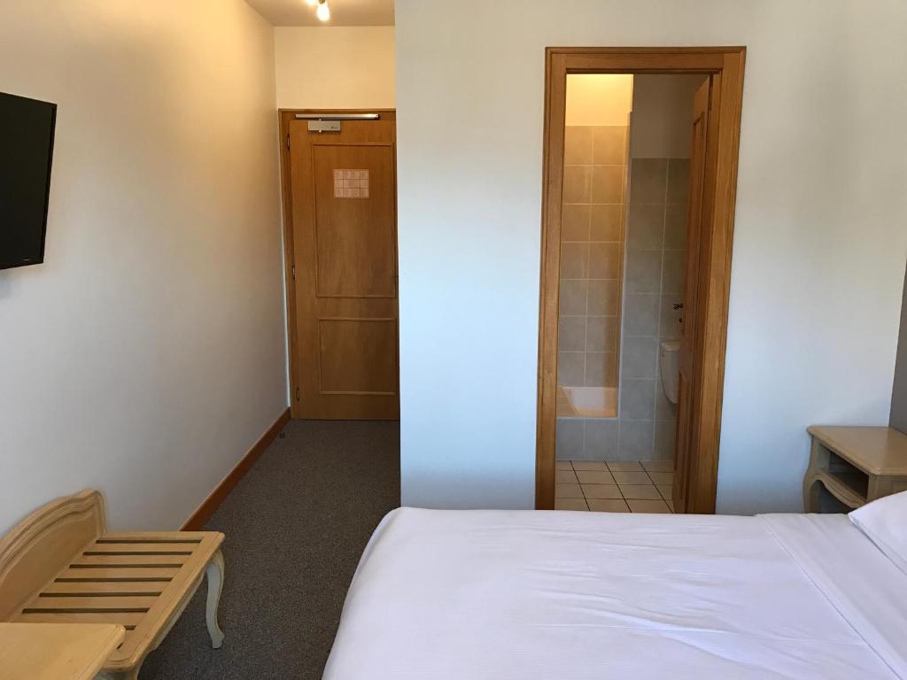 Postel nebo postele na pokoji v ubytování Hôtel du Rangen