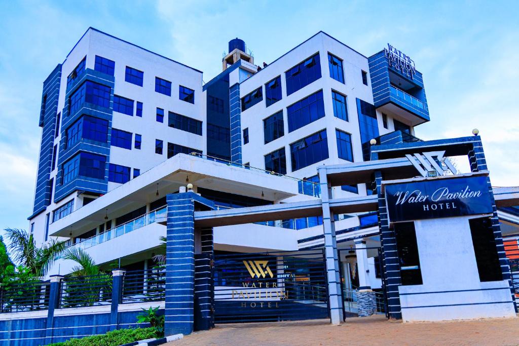 a building with a sign in front of it at WATER PavilioN HOTEL in Keroka