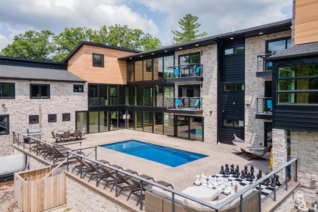 an exterior view of a home with a swimming pool and a house at Sweet Dreams by Railey Vacations in McHenry