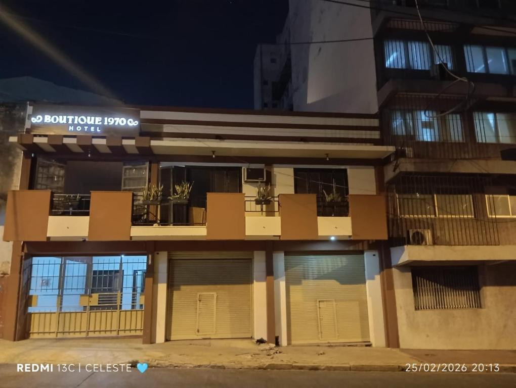 a building with two garage doors in front of it at Boutique 1970 Hotel in Asunción