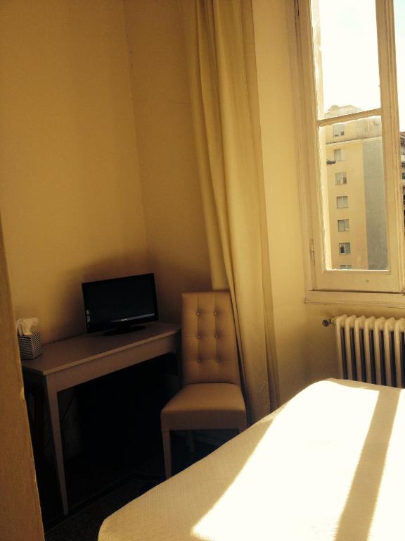 Postel nebo postele na pokoji v ubytování Hotel Miramare
