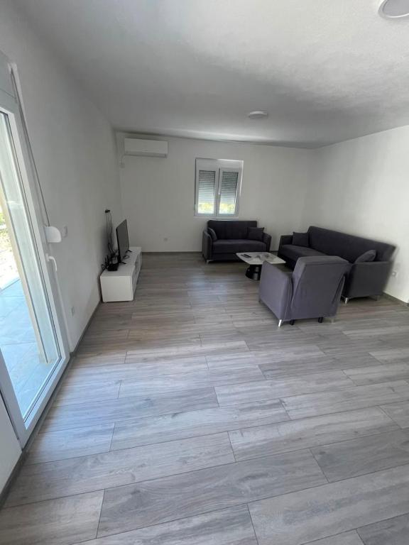 a living room with a couch and a table at Rujovic 
