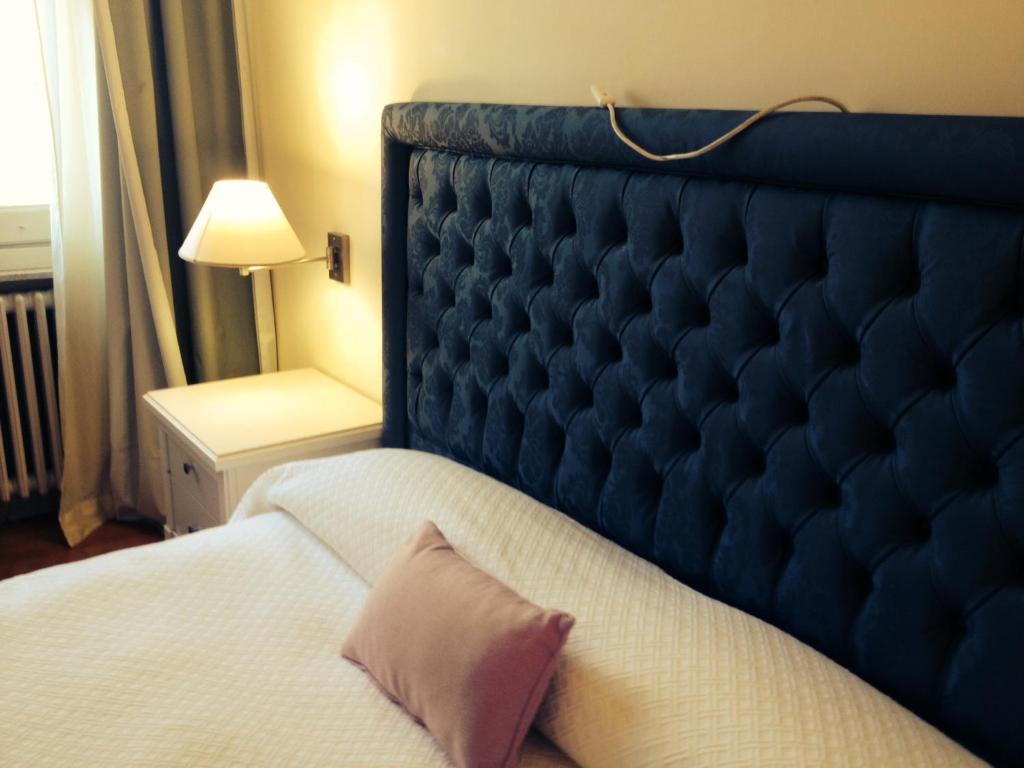 Postel nebo postele na pokoji v ubytování Hotel Miramare