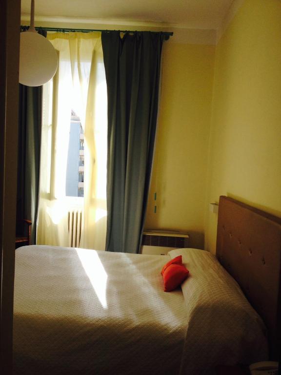 Postel nebo postele na pokoji v ubytování Hotel Miramare