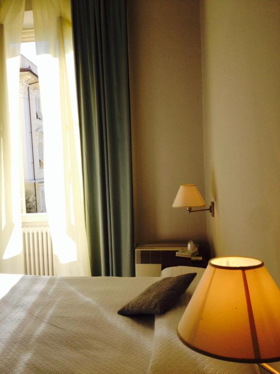 Postel nebo postele na pokoji v ubytování Hotel Miramare