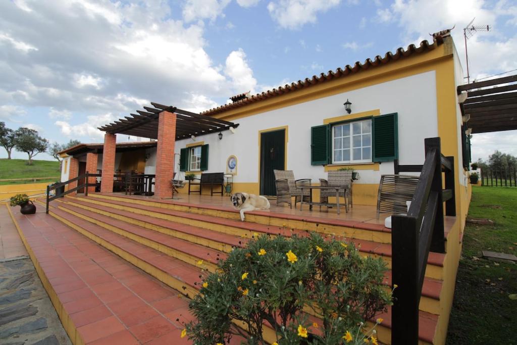 a large wooden deck with a house at Quinta Moinho Meirinho in Crato