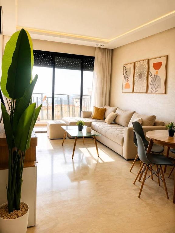a living room with a couch and a table at Premium studio Casablanca in Maarif