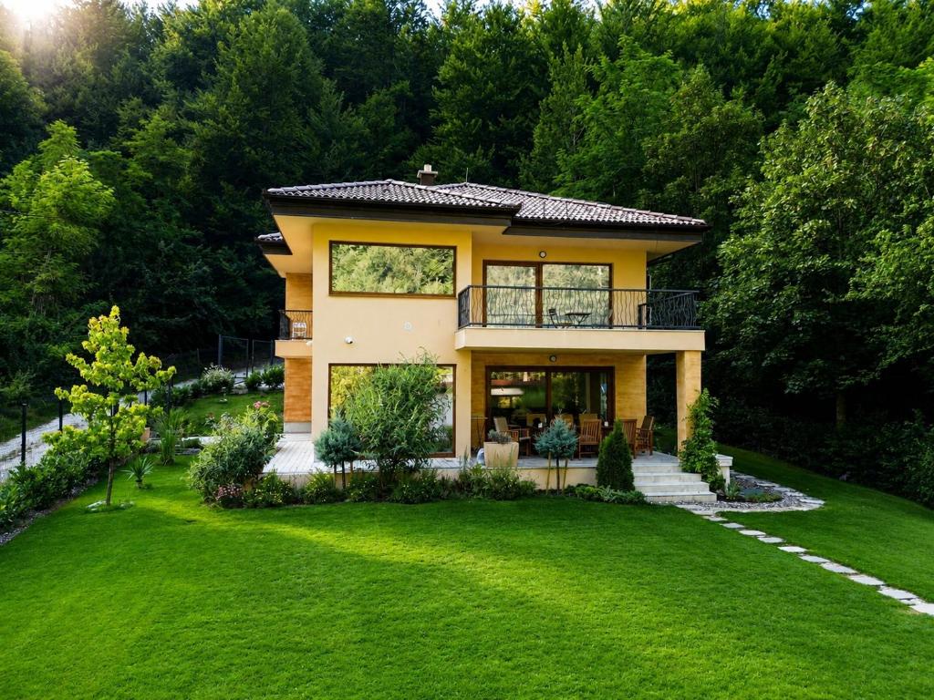 a house with a large yard at Villa Rivus - Private Family Retreat near Sarajevo in Sarajevo