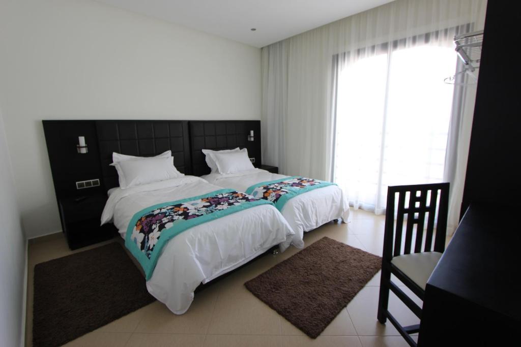 Postel nebo postele na pokoji v ubytování Hotel El Djenina