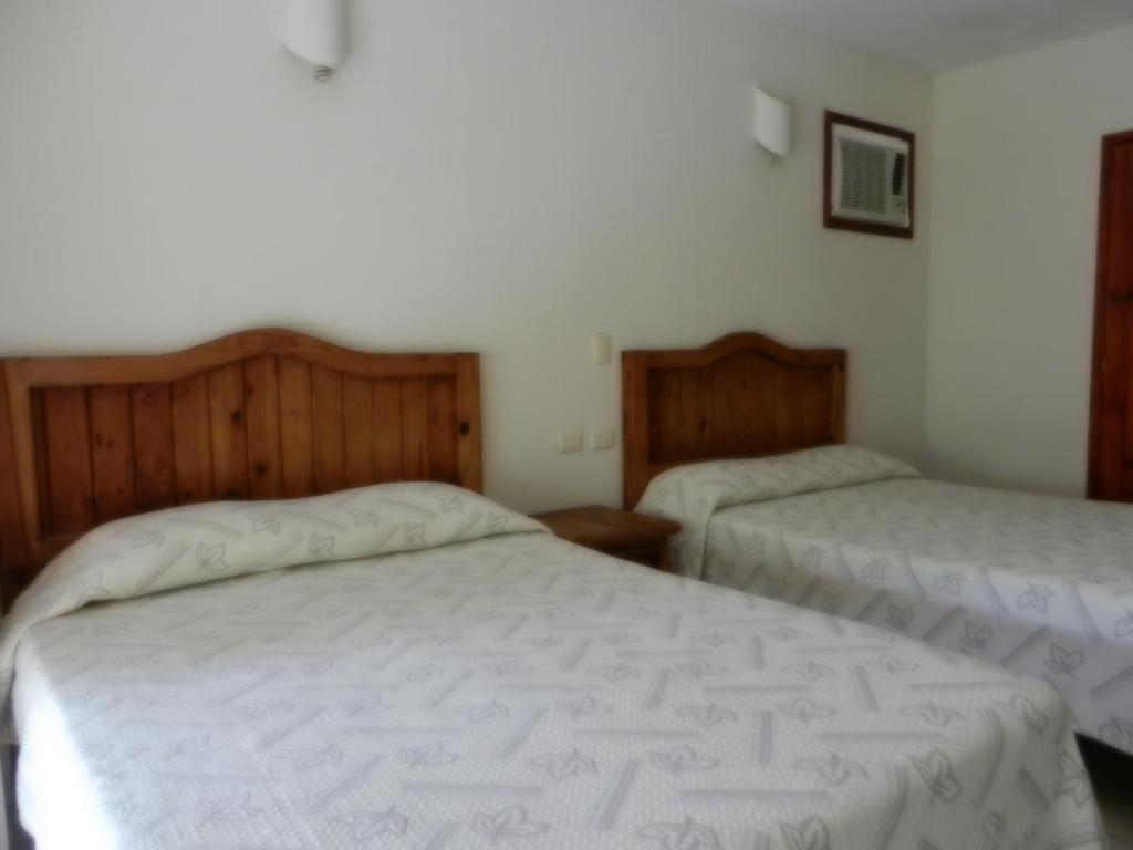 Postel nebo postele na pokoji v ubytování Hotel Istirinchá