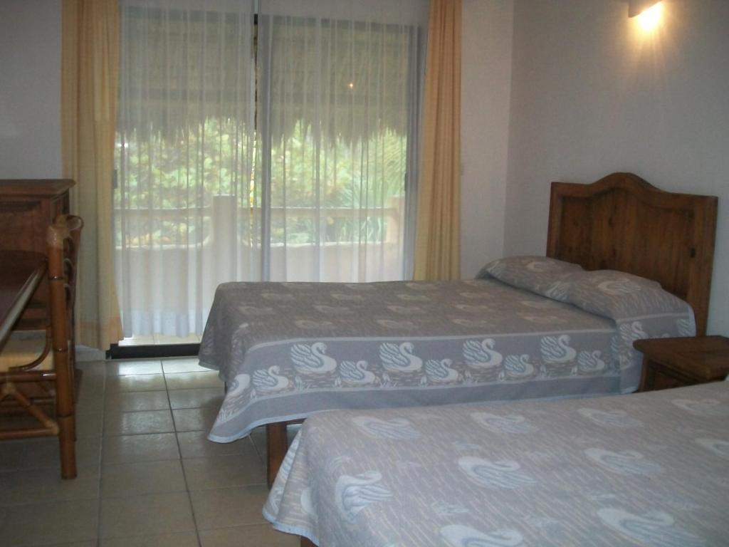 Postel nebo postele na pokoji v ubytování Hotel Istirinchá