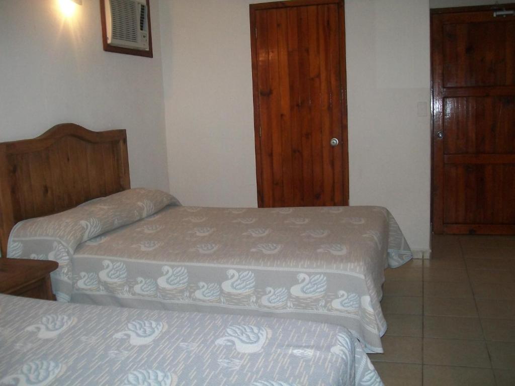 Postel nebo postele na pokoji v ubytování Hotel Istirinchá