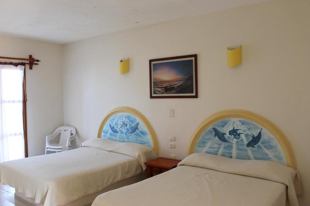 Postel nebo postele na pokoji v ubytování Hotel Istirinchá