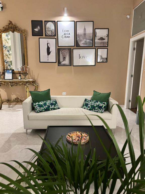 a living room with a couch and a table at TIZIANA'S HOUSE in Salerno